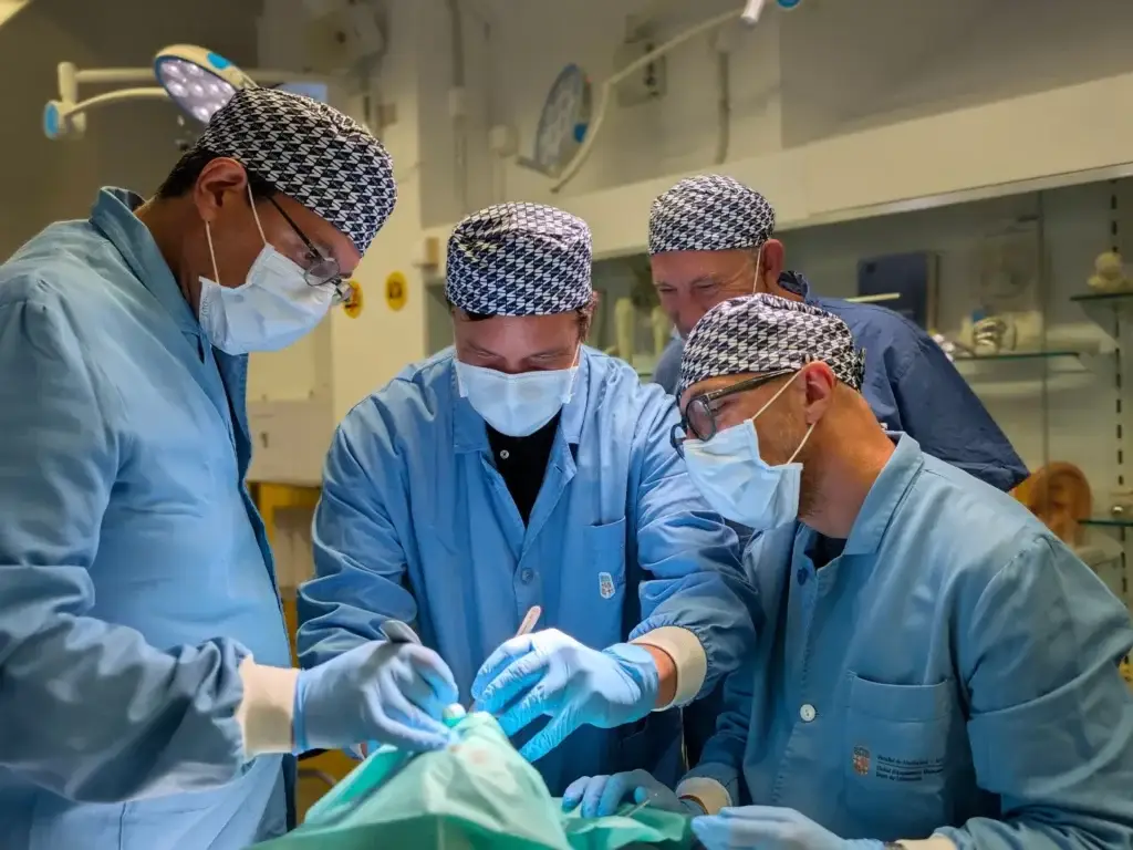 Dr. Vadimir and Dr. Lorean with the participants during the cadaver session